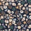 CHARLOTTE MIDNIGHT wallpaper with dark background and a selection of shells, seaweed, starfish and seahorses in blue, beige, green